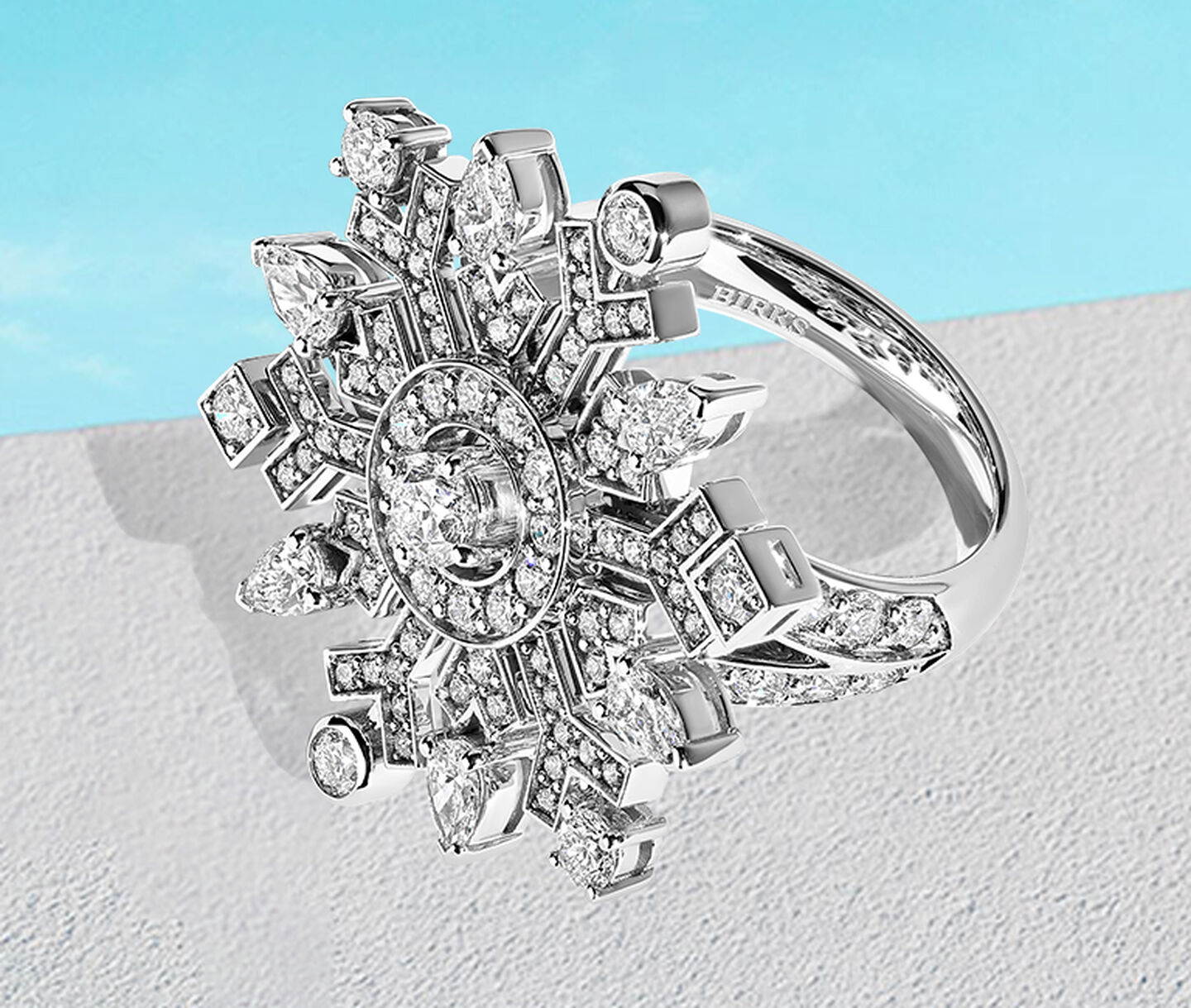Birks Snowflake High Jewellery diamond ring on a blue background.